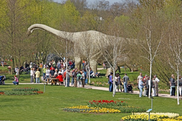 Visitors, dinosaur statue, Tulip Festival, garden show, Kaiserslautern, Rhineland-Palatinate, dinosaurs, Germany, Europe