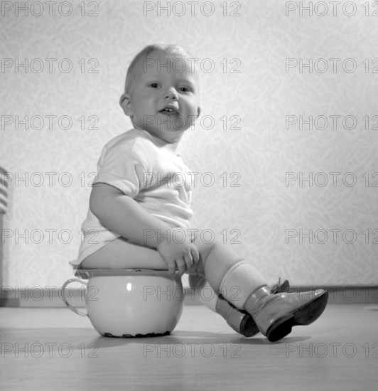 In the 1950s. A toddler boy is pictured sitting on the potty. Sweden 1956. Conard ref 3158