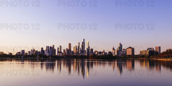 The iconic Albert Park lake and skyline views at sunset in Melbourne, Victoria, Australia, Oceania