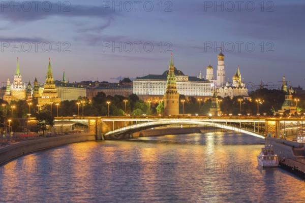 Illuminated Moscow Kremlin and Moscow River with bridge at night. Russia