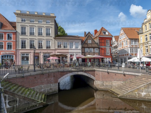 Brick-walled barrel-vaulted bridge Hudebrücke and stairs to the river Schwinge as well as historic half-timbered houses and gabled houses in the old town of Stade, Hanseatic city of Stade, Lower Saxony, Germany, Europe