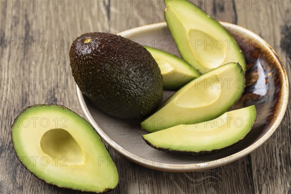 Avocado isolated on a wooden table