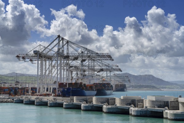 Tangier, Morocco, 1 April, 2024: container ships being unloaded and loaded at Tanger Med port in Morocco, Africa