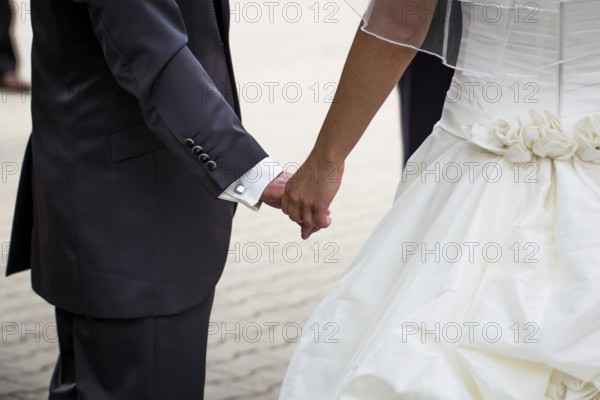 Couple holding hands
