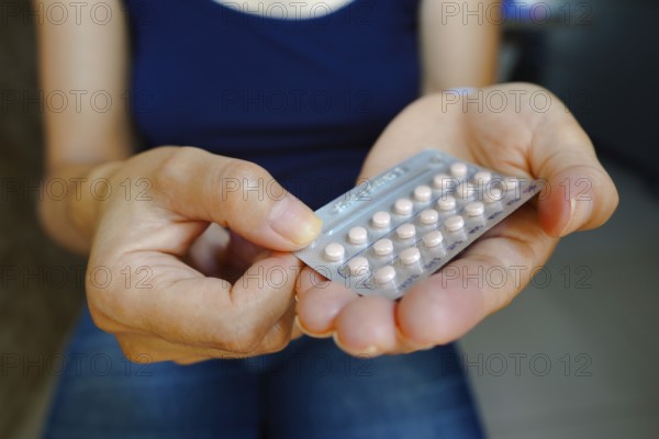 March 16, 2024, Brazil. A woman holds her birth control pill. The medication is a pill that contains a combination of hormones, usually synthetic estrogen and progesterone, that inhibit ovulation