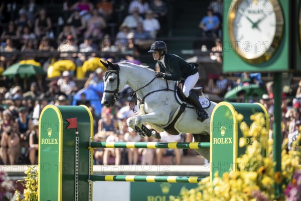 Hilary Scott of Australia and riding Oaks Milky Way compete in the first round of the 1.60m CPKC International during the Spruce Meadows Masters, presented by Rolex, in Calgary, Alberta, Canada, North America