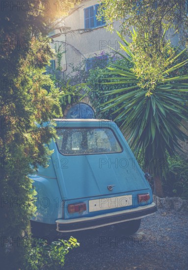 European Travel Image Of A Vintage Car Outside A French Chateau Or Holiday Home In The Evening Light