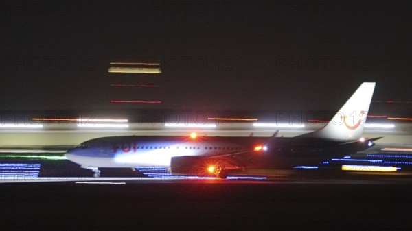 TuiFly Boeing 737 landing at night at Stuttgart Airport