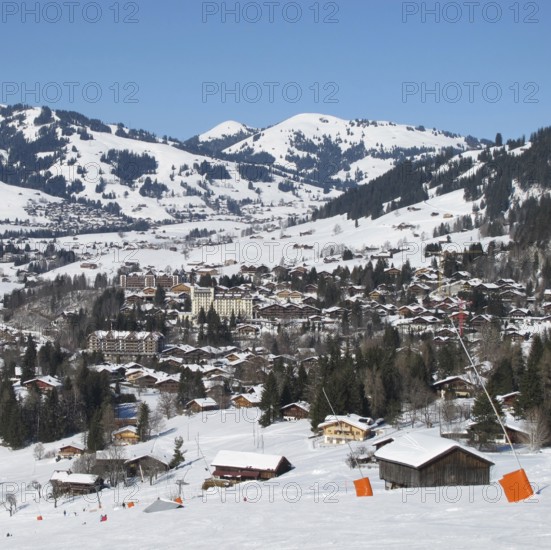 Ski slope and view of Gstaad in winter