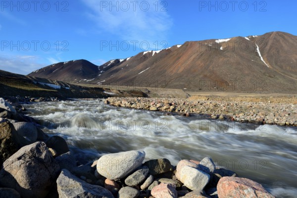Meltwater river, after snowmelt, Anstead Point, Ellesmere Island, Nunavut, Canada, North America