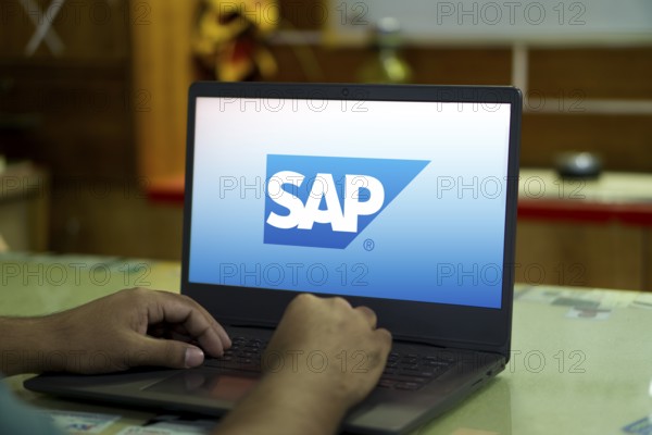 SAP SE logo is displayed on smartphone. SAP SE is a German multinational software company based in Walldorf, Baden-Württemberg.