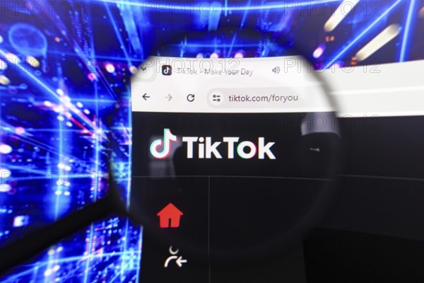 April 17, 2024, Brazil. In this photo illustration, the TikTok logo seen displayed on a computer screen through a magnifying glass