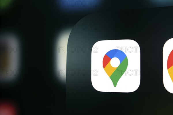 A close up of an iPhone screen displaying the Google maps logo
