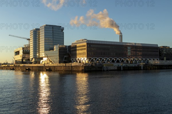 Construction site of the Westfield Hamburg-Überseequartier shopping centre, which was severely delayed due to construction defects, in the evening light on the Elbe, Hafencity, Hamburg, Germany, Europe