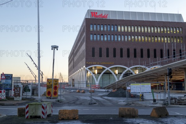 Construction site of the Westfield Hamburg-Überseequartier shopping centre in the evening light, Hafencity, Hamburg, Germany, Europe