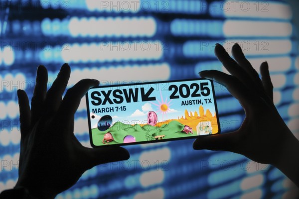 In this photo illustration, the South by Southwest (SXSW) 2025 logo is displayed on a smartphone screen