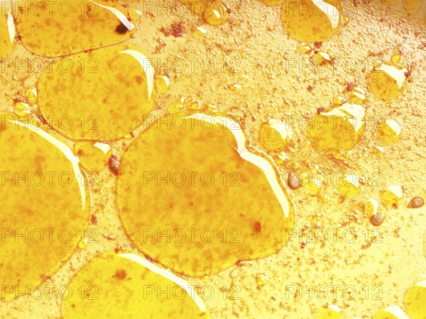 Close up of grease eyes in the baking dish using as background