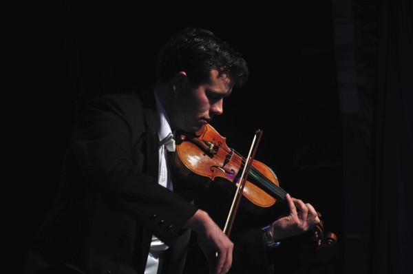 Violinists performing in live concert