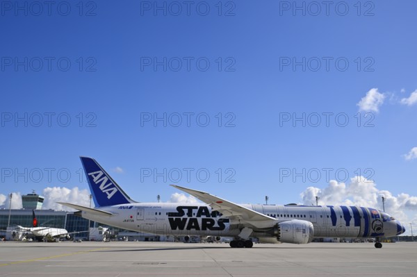 ANA Star Wars special aircraft Boeing B787 Dreamliner taxiing with control tower, Apron 2 East, Satellite, Terminal 2, Munich Airport, Upper Bavaria, Bavaria, Germany, Europe