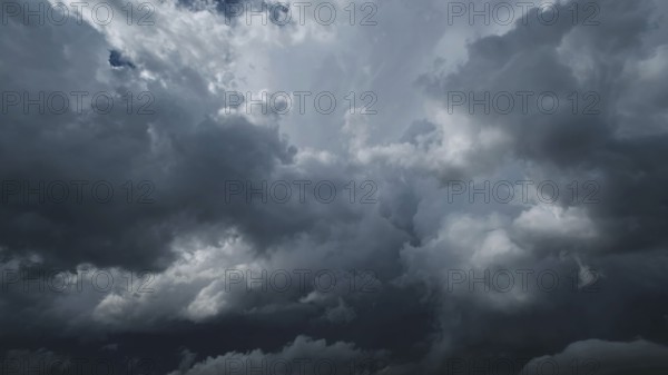 Dramatic dark storm clouds in sky background