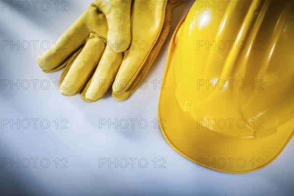 Safety gloves hard hat on white background
