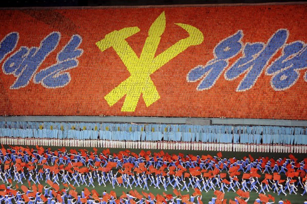 08.08.2012, Pyongyang, North Korea, Asia, Dancers and acrobats at the Arirang Festival at the Rungrado May Day Stadium in Pyongyang. The majority of the performances during the mass event are performed by dancers from the field of rhythmic gymnastics, who have been trained and rehearsed for months in advance. An estimated 100, 000 dancers, acrobats and participants celebrate their patriotism and the socialist unity of the Juche ideology. The event takes place every year in the warm summer months from July to September, Asia