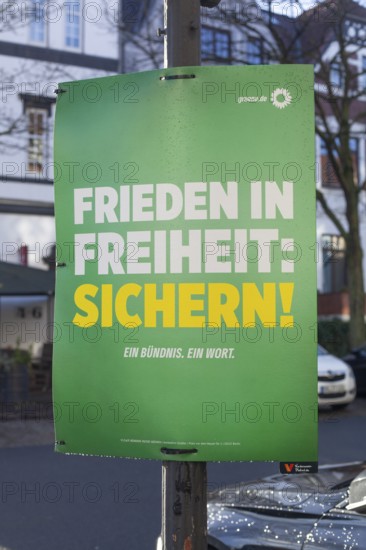 Election poster of the party Bündnis 90 Die Grünen for the Bundestag election 2025 with the text Frieden in Freiheit sichern, Bremen, Germany, Europe