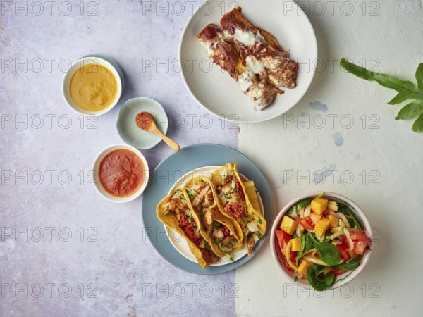 Mexican tacos with sauces and salad flat lay