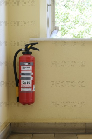 Berlin, Germany, June 23, 2024, Fire extinguisher in the stairwell of a residential building, Europe