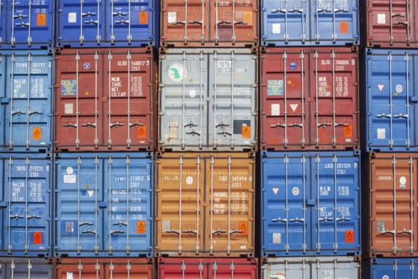 Stacked colourful freight containers at the container terminal in Holz-und Fabrikenhafen, Bremen, Germany, Europe
