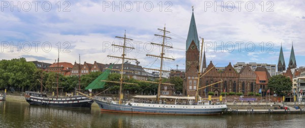 Panoramic photo of the promenade on the Weser with the sailing ship restaurants Dreimaster Alexander von Humboldt and Admiral Nelson and in the background St. Martini Church, Old Town Bremen, Hanseatic City of Bremen, Germany, Europe