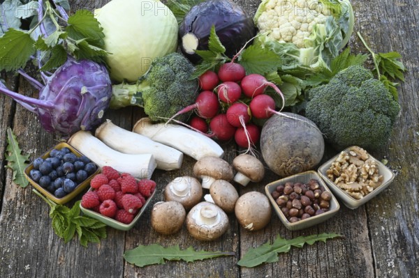 Healthy food, berries, cabbage, radishes, king oyster mushrooms, raspberries, nuts, blueberries, mushrooms