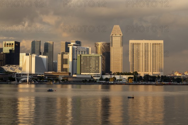 Skyline at sunset with Pan Pacific skyscraper and Mandarin Oriental Hotel, Marina Bay, Singapore, Singapore, Asia