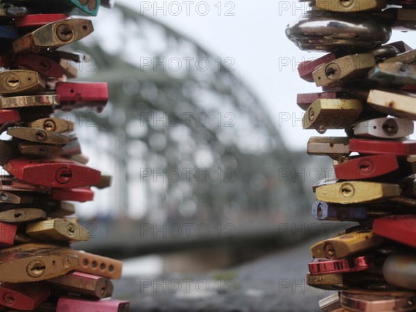 Love locks on a bridge over the Rhine, blurred background, Cologne, Germany, Europe