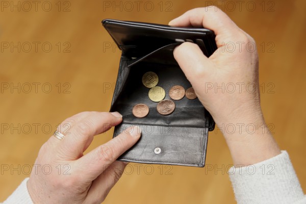 Woman shows her empty wallet