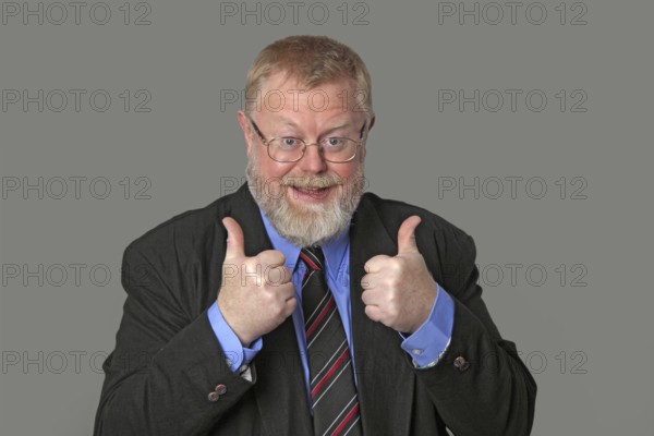 Man holds both thumbs up