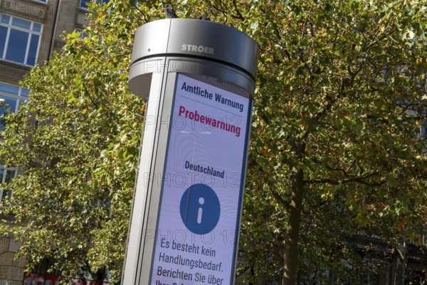 Symbolic image disaster control, advertising pillar with the display Official warning, test warning, city centre, Hamburg, Germany, Europe