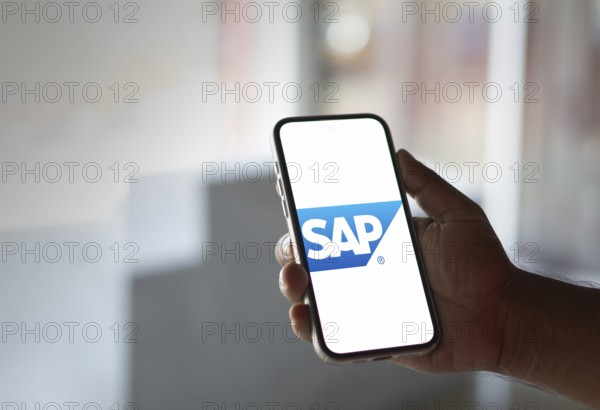 SAP SE logo is displayed on smartphone. SAP SE is a German multinational software company based in Walldorf, Baden-Württemberg.