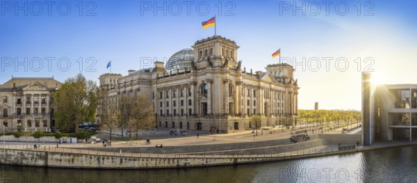the famous reichstag building during sunset