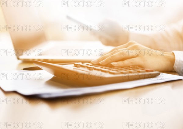 Close up businessman doing some calculations