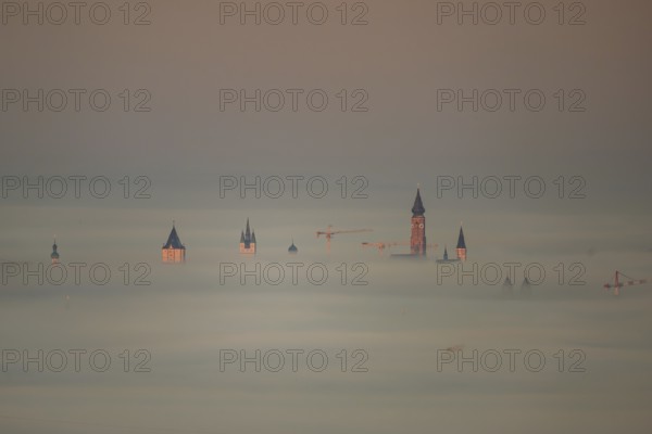 The towers of the town of Straubing (Lower Bavaria) in the morning mist