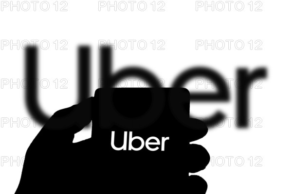 Uber logo on smartphone, Uber is an American company offering transportation services online.