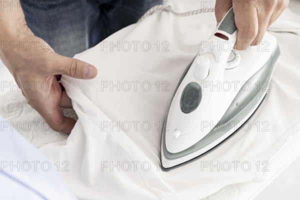 Man ironing clothes close up. Resolution and high quality beautiful photo