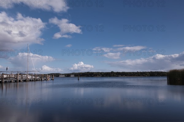 View over the Scharmützelsee with jetty and marina, long exposure, Wendisch-Rietz, Brandenburg, Germany, Europe