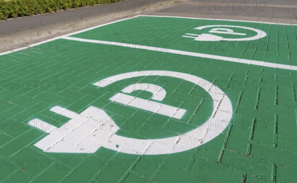Parking place with charging symbol for electric cars