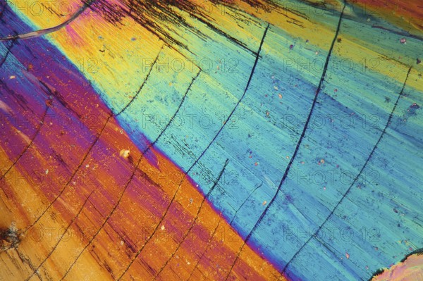 Thulium is a rare earth element. The crystals are precipitated from a solution on a microscope slide and photographed in polarized light