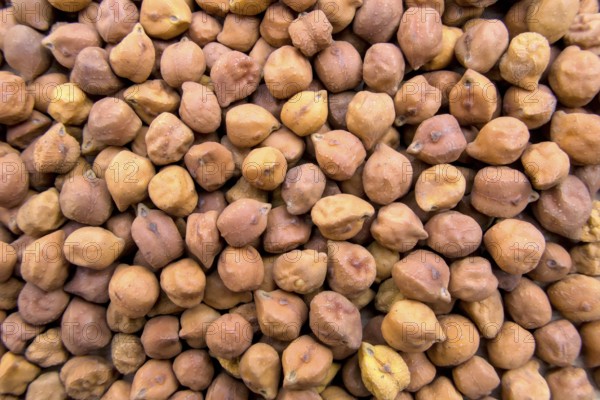 Full-Frame Close-Up of Black or Brown Chickpeas with Textured Details, Top View