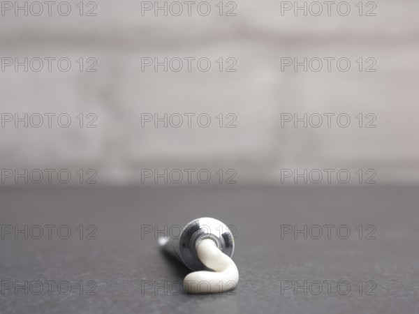 Close up of a cream tube on a bathroom table