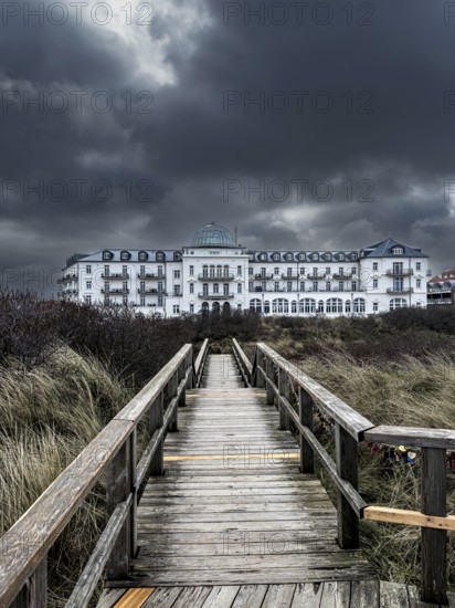 Dramatic clouds over the spa hotel on Juist, East Frisian Islands, Germany, Europe