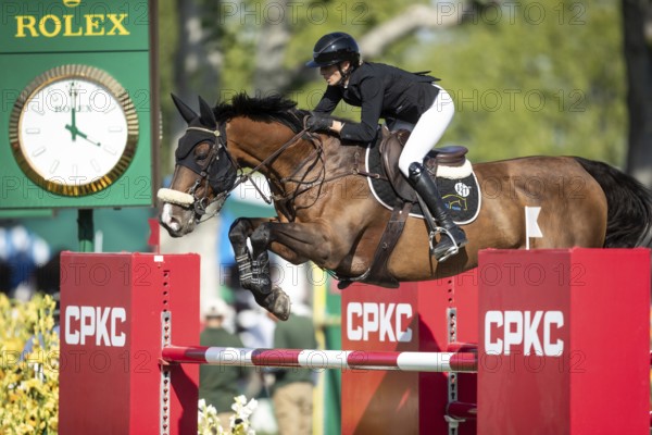 Katie Laurie of Australia riding on Django II competes in the second round and jumpoff of the CPKC International GP at Spruce Meadows Masters, in Calgary, Alberta, Canada, North America